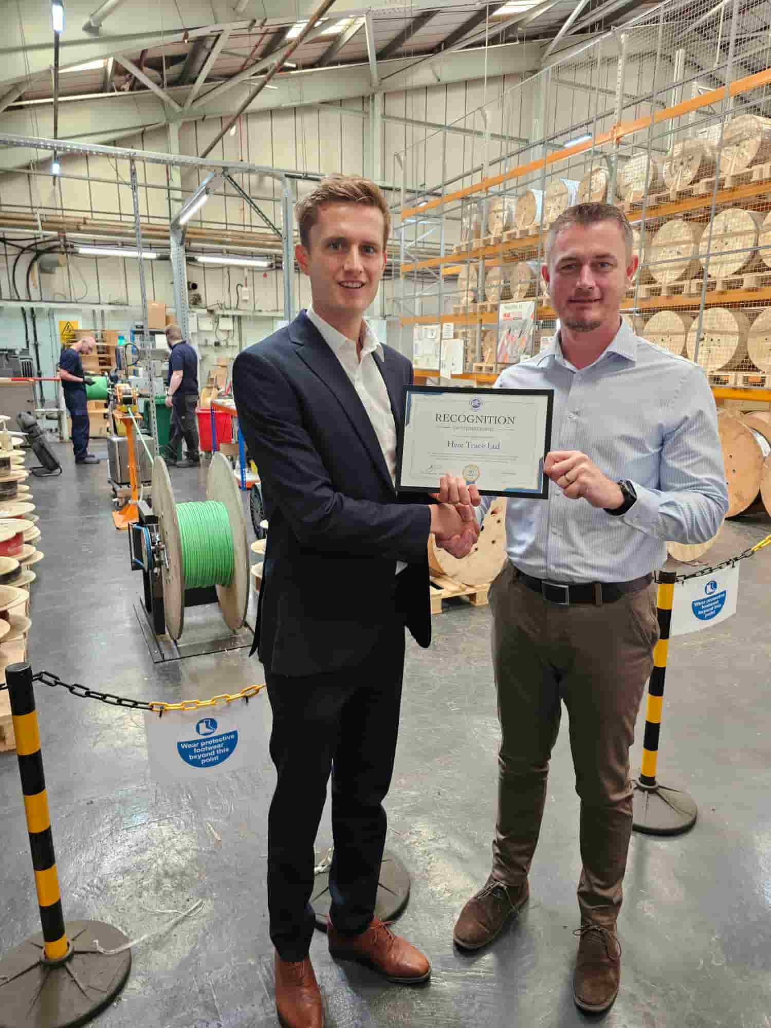 Keith Wylie being presented with the EIC 10 year membership certificate by Andrew Scutter of the EIC