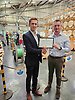 Keith Wylie being presented with the EIC 10 year membership certificate by Andrew Scutter of the EIC