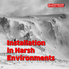 A snowy cliff with the text in red 'Installation in harsh environments'